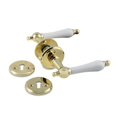 Jasa Company Husmandsgreb med dørgrebsroset og nøgleskilt, Ø20 mm, messing/hvid porcelæn